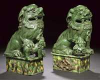 Kangxi A pair of green glazed Buddhistic lions